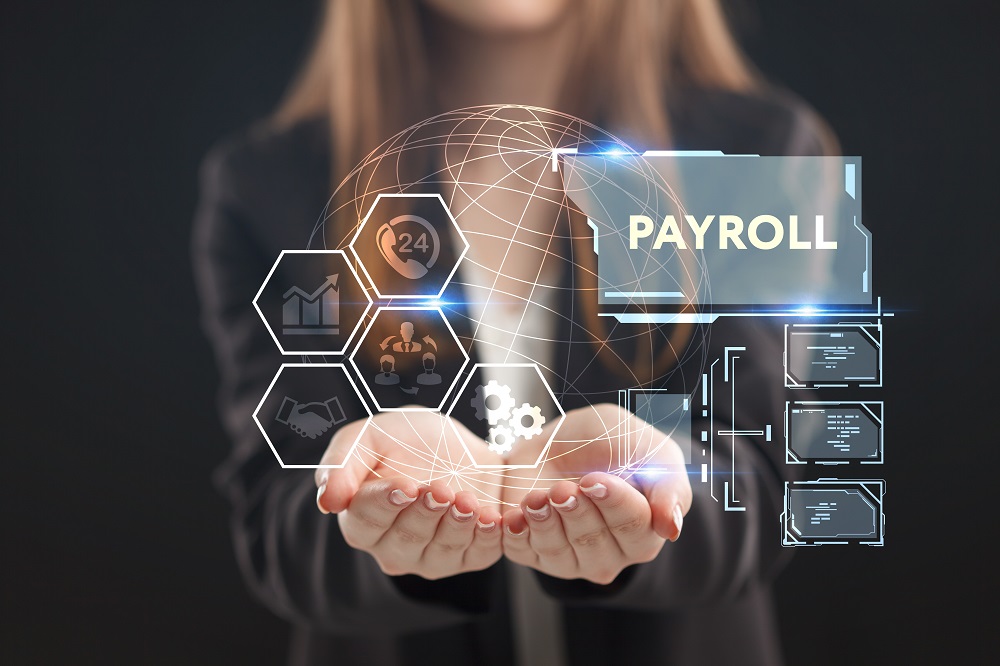 The concept of business, technology, the Internet and the network. A young entrepreneur working on a virtual screen of the future and sees the inscription: Payroll | Virtual Assistant For Doctors