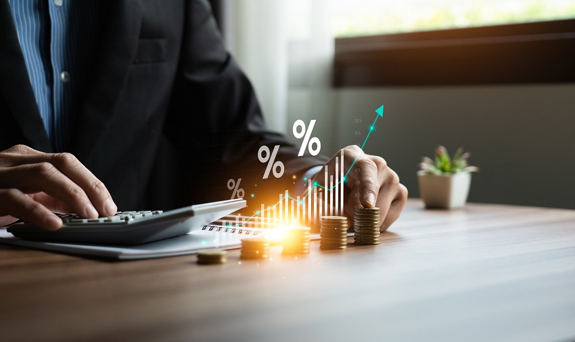 Interest rate and dividend concept, Businessman is calculating income and return on investment in percentage. income, return, retirement, compensation fund, investment, dividend tax, stock market