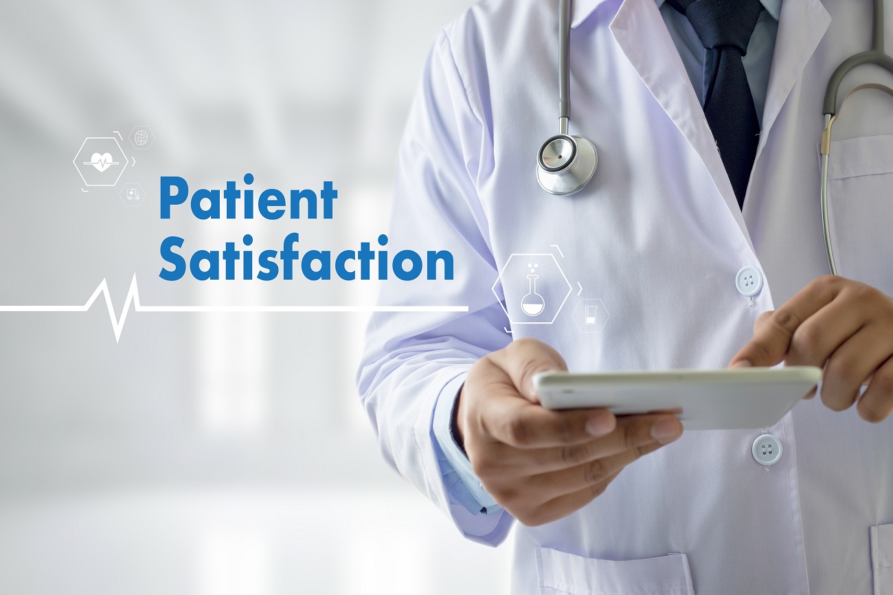 Patient Satisfaction Concept - A Doctor Holding a Tablet | VAForDoctors